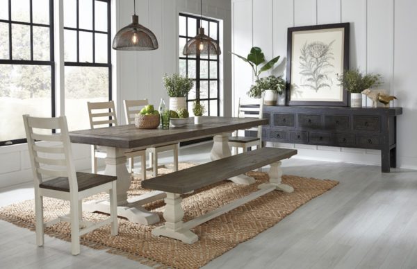 long black carved wood console in dining room setting