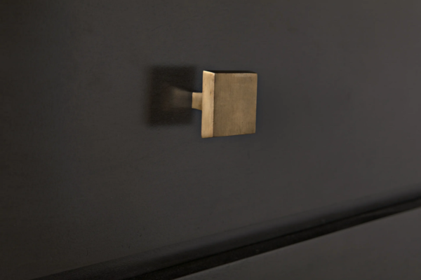 Modern black dresser with brass hardware, detail