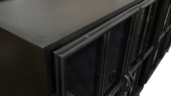 Industrial style black iron cabinet with glass doors top detail