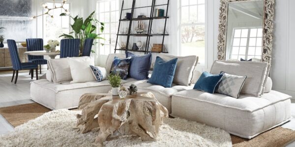 Tree root coffee table natural color seen in living room with white sectional