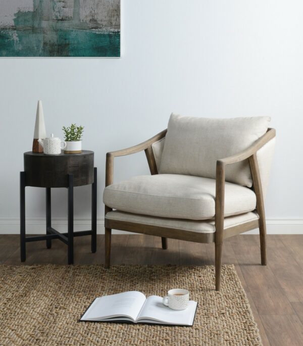 off white upholstered chair with wood frame in living room setting