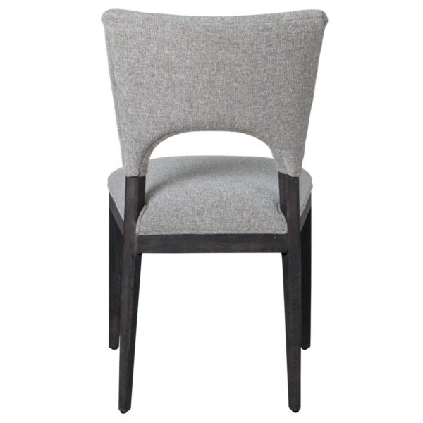 grey upholstered dining chair with black wood frame back view