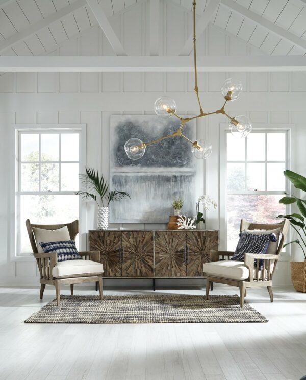 upholstered linen chair with wood frame in living room setting