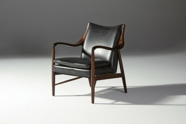 black leather chair with wood frame side view