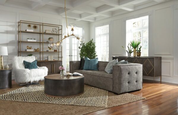 Grey fabric sofa with square arms in living room setting seen from side