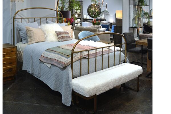 Iron bed with brass finish shown in bedroom setting