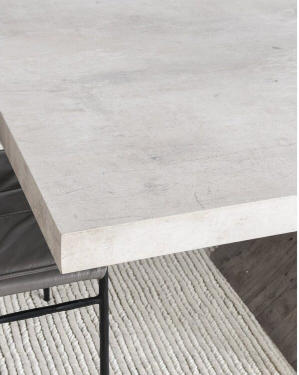 Concrete top dining table with wood crossbeam base, top detail