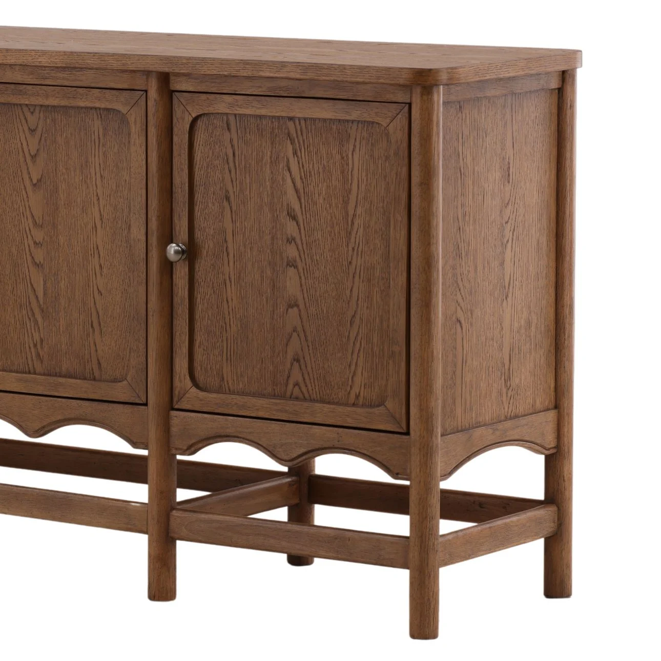 Sideboard in brown finish featuring four paneled cabinet doors, rubber wood construction with oak veneer, and a classic design on a sturdy leg base, corner detail