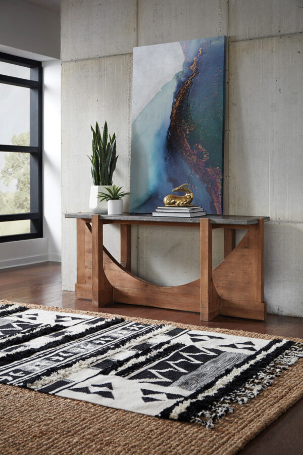 Wood console table with stone top in room setting