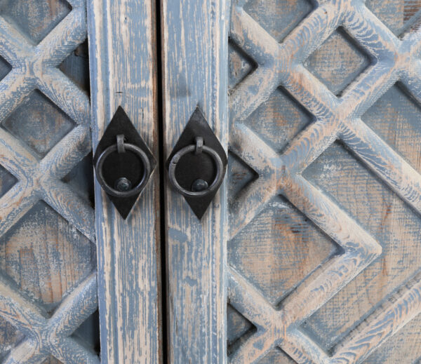 light distressed blue wood sideboard close up hardware