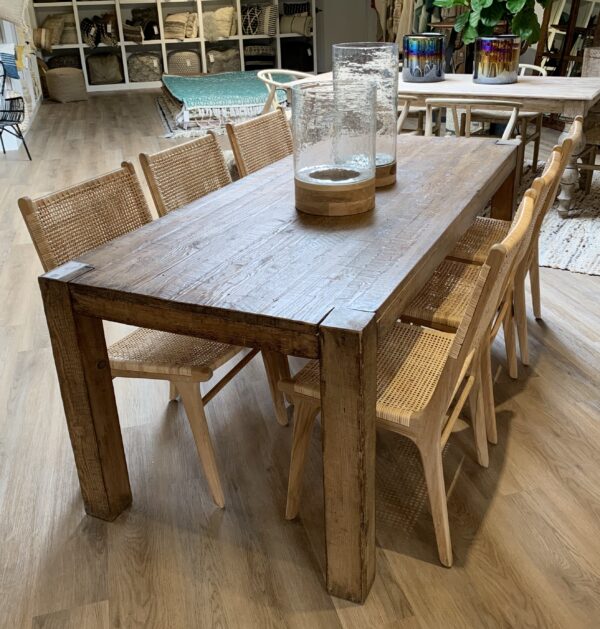 Reclaimed wood pine dining table with straight legs with rattan dining chairs