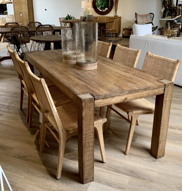Reclaimed wood pine dining table with straight legs with rattan dining chairs