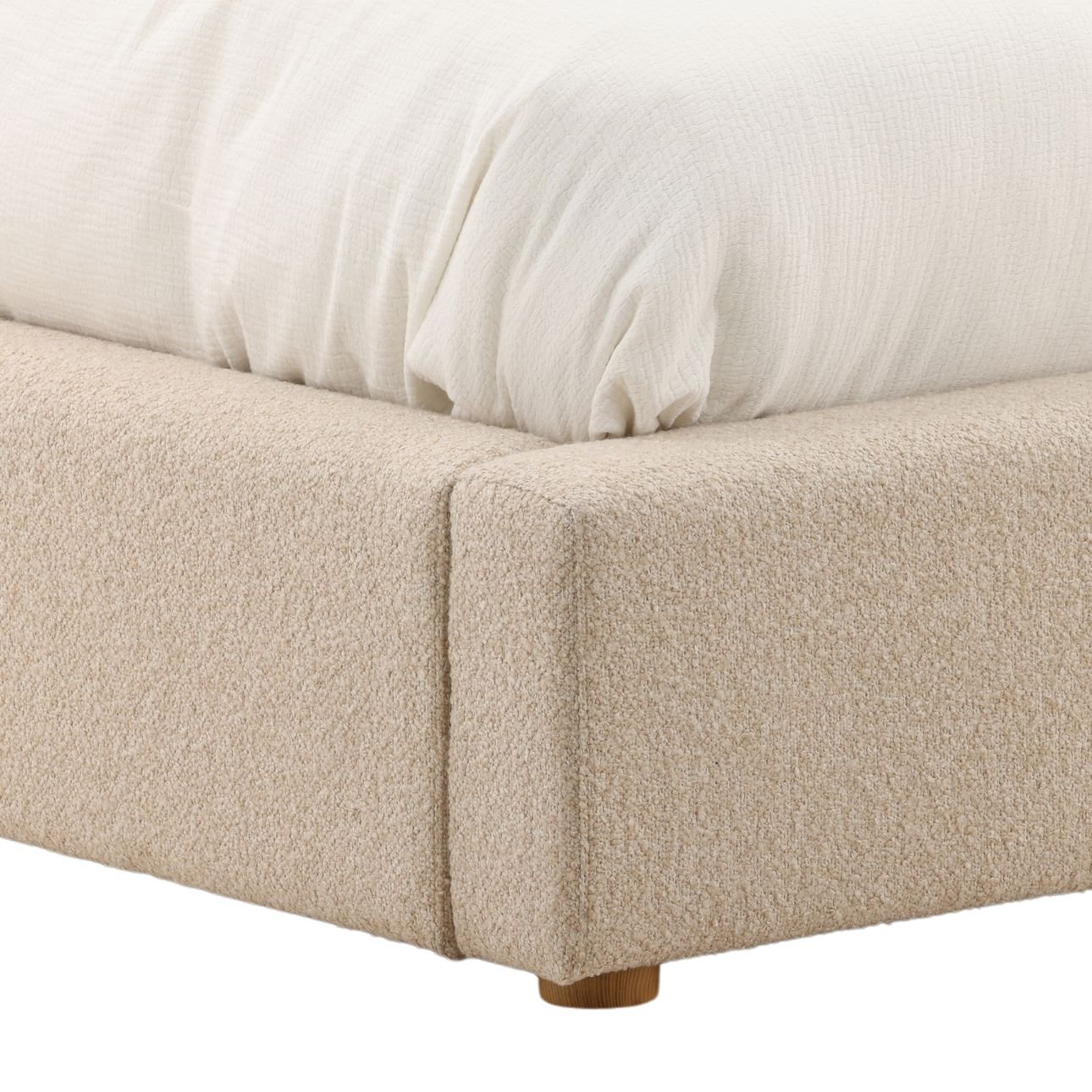Modern upholstered bed in Wilshire Sand with chunky boucle fabric and clean, low-profile design, detail