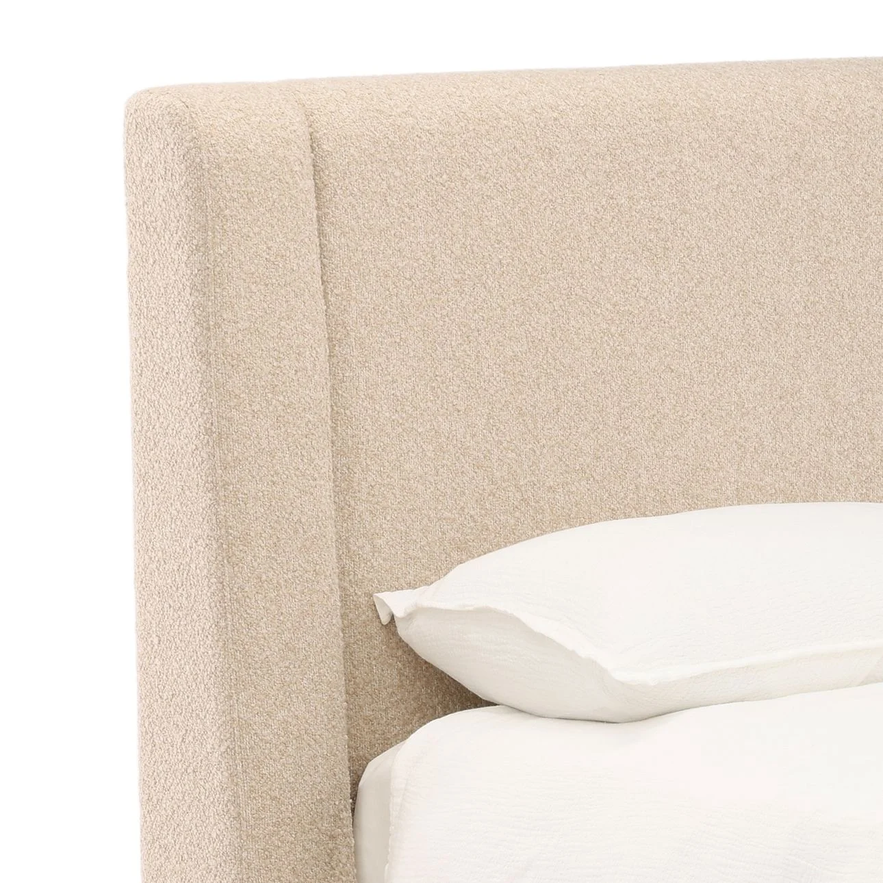 Modern upholstered bed in Wilshire Sand with chunky boucle fabric and clean, low-profile design, detail