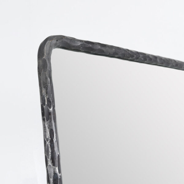 hammered metal frame mirror close up