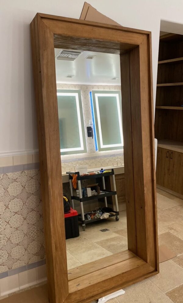 88" tall floor mirror with wood frame in a medium brown finish