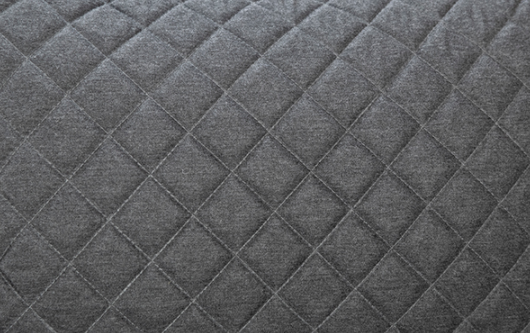 grey fabric pillow close up