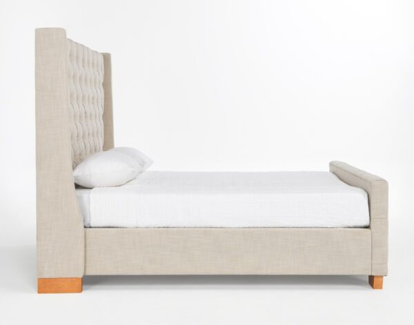 Light grey upholstered tufted queen size bed, side view