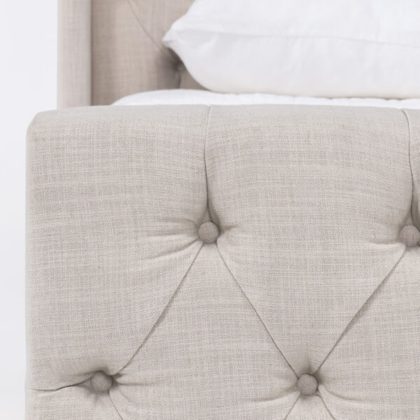 Light grey upholstered tufted queen size bed, detail