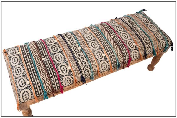 Wood bench with multicolor Indian fabric view from top