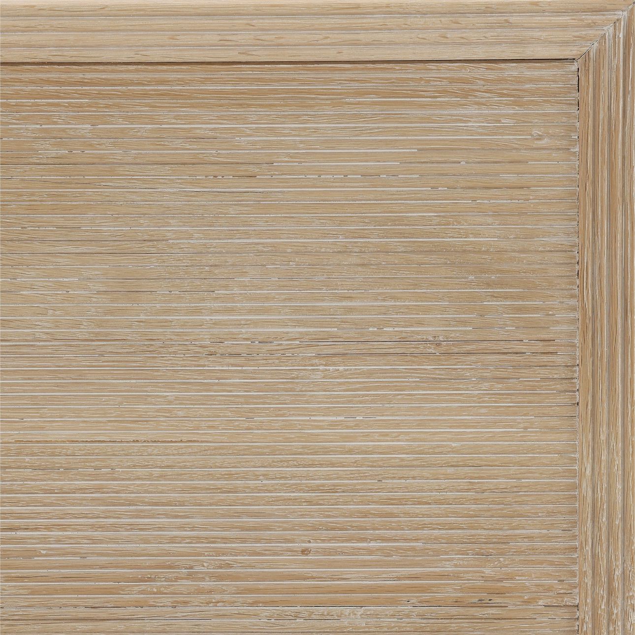 The Isla Desk is crafted from solid oak wood with a beautiful light natural finish. Featuring reeded details and three drawers, it's perfect for a home office or vanity, side detail