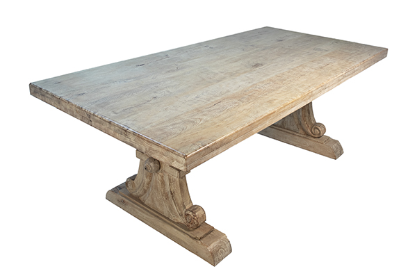 natural color wood trestle dining table with extensions seen from the top