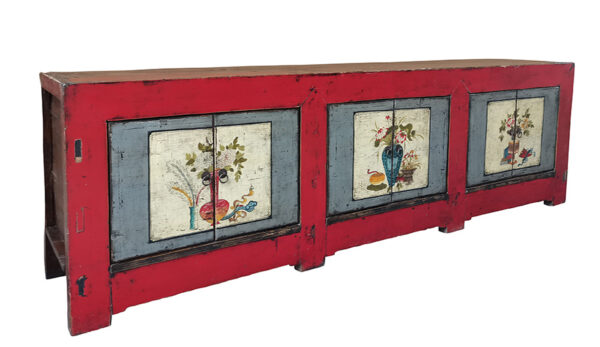 Large red sideboard with flowers painted on doors
