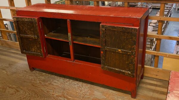 Red Chinese cabinet shown with doors open
