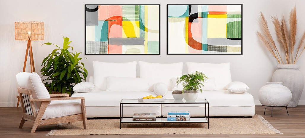 living room with white sofa and colorful art