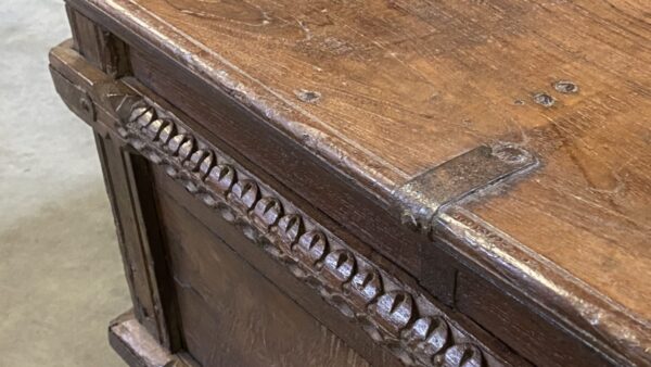 Brown vintage trunk with carved body, detail