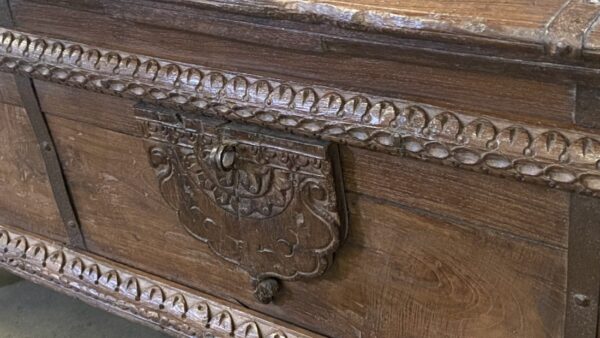 Brown vintage trunk with carved body, latch detail