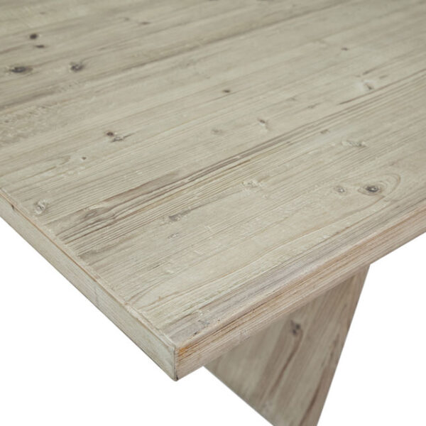 Large pine wood dining table with light finish, detail