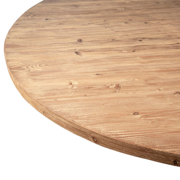 Round pine wood dining table with scroll legs, close up