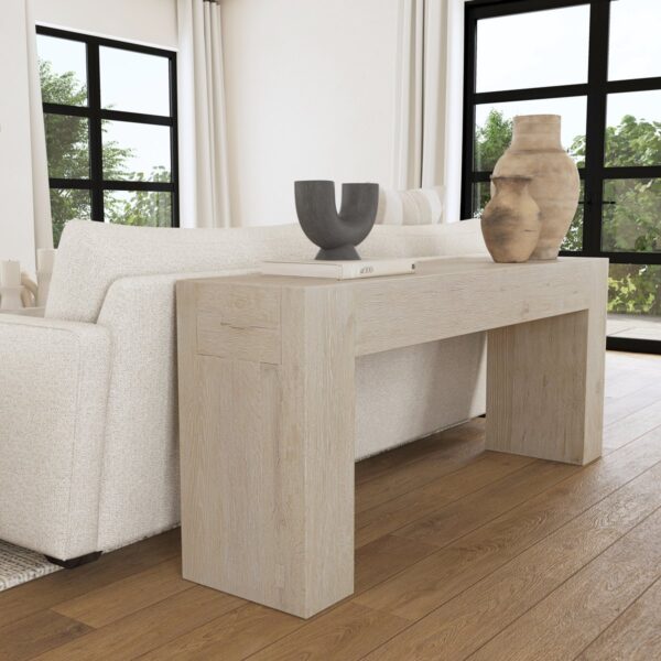 Solid oak wood console table in light cream finish, seen in home setting