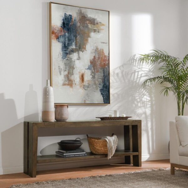 Brown oak wood console table with bottom shelf, shown in home setting