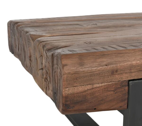 Rustic style coffee table with reclaimed wood top and iron base, corner detail