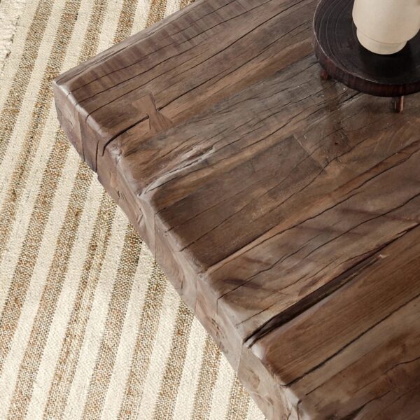 Rustic style coffee table with reclaimed wood top and iron base, detail