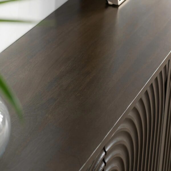 Dark brown media cabinet with curved, textured front, top close up