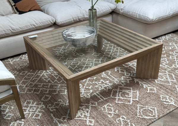Square wood coffee table with glass top