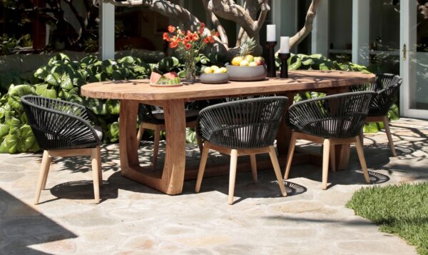 large teak dining table seen in patio