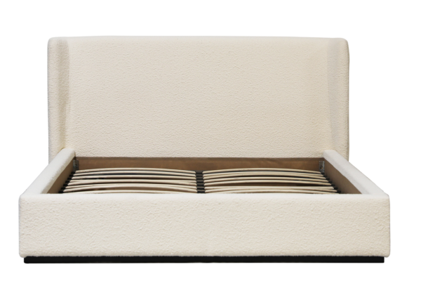Cream upholstered bed with wing headboard, front