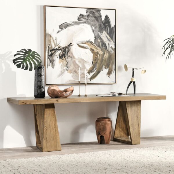 Long, modern, reclaimed oak console table with angular base, shown in home setting