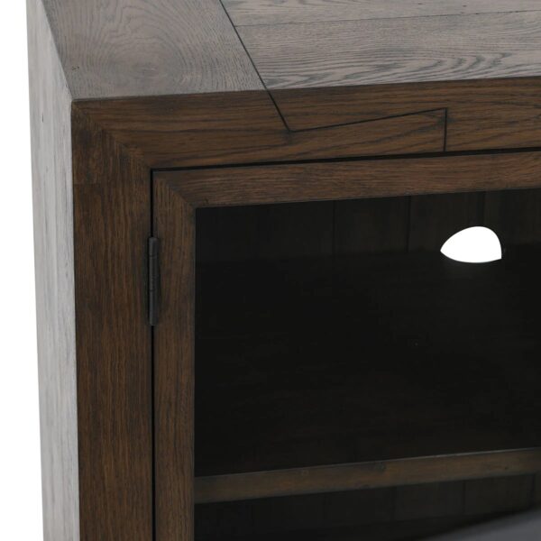 Solid oak wood media console with tempered glass doors and shelves, close up