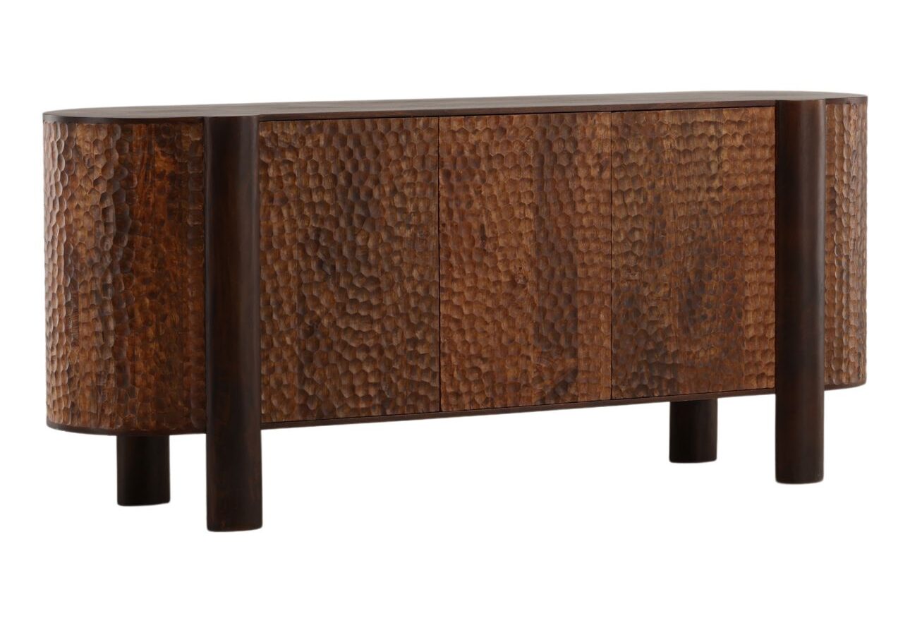 Three-door mango wood sideboard with carved geometric door detailing, natural wood finish, and concealed interior storage. Three quarter view