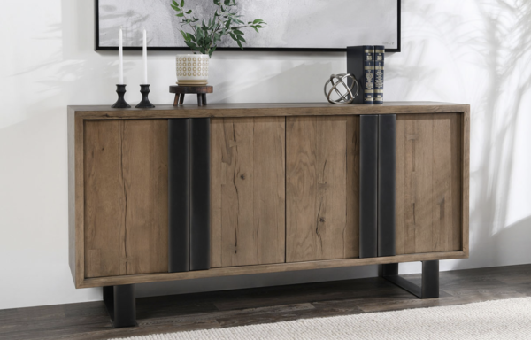 4 door sideboard in brown with large iron handles and base, shelf in the interior, vignette