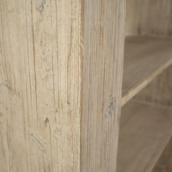 Modern rustic bookshelf with 4 shelves in a light warm wash finish, detail