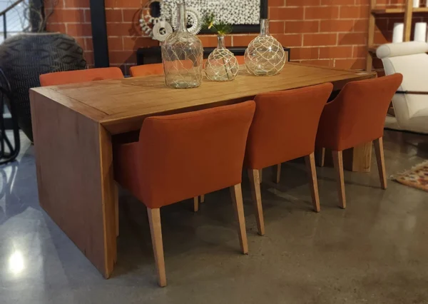 Large simple dining table with solid planks at the end of table, natural wood, no finish, in a set with chairs