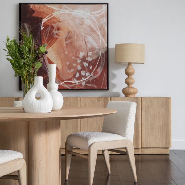 Long pine sideboard media console with clean lines and natural wood texture, shown in a dining room