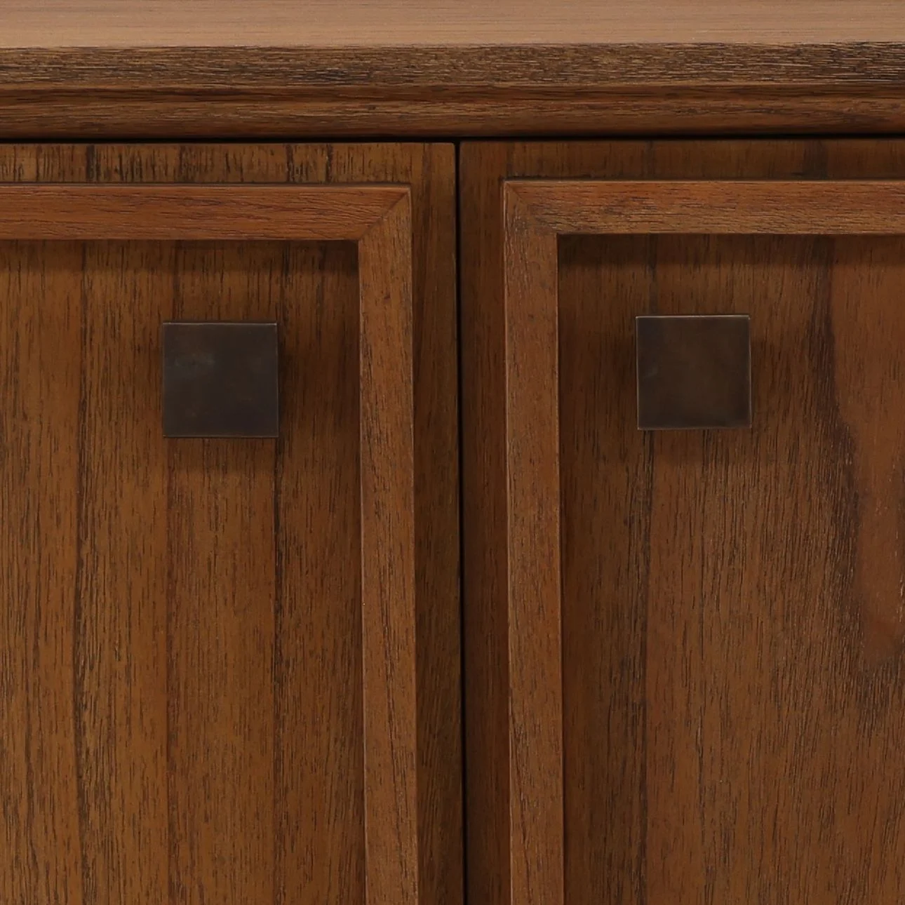 Four-door sideboard crafted from Mindi wood and veneer with a rich wood finish, clean lines, raised legs, and spacious concealed storage compartments. Detail 2 doors