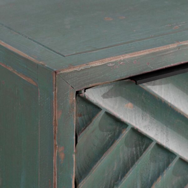 Teal color media cabinet with textured doors, interior shelves and cable holes, close up